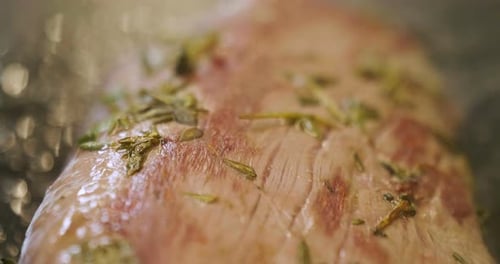 Close Up of Raw Meat with Green Herbs
