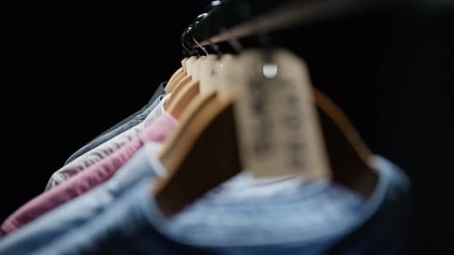 Shirts on Rack Focus to Black Friday Tag