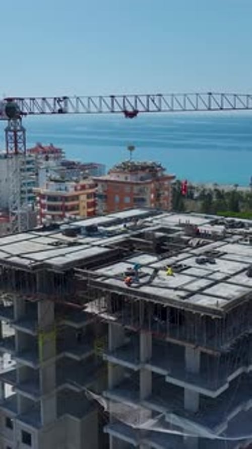 Vertical Video of Seaside Villas With Blue Infinity Pool Edge