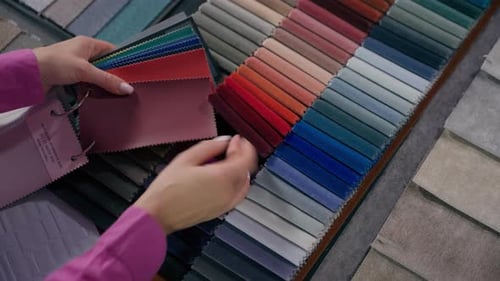 Close Up Details Fabric Swatches Different Trend Colors Sample Collection on Table Unrecognizable