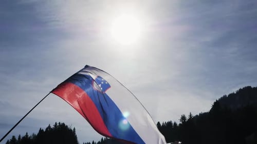 Slovenia Flag Waving Against Sunny Sky