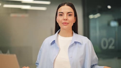 Calm Businesswoman Meditates at Office Desk for Focus and Wellness