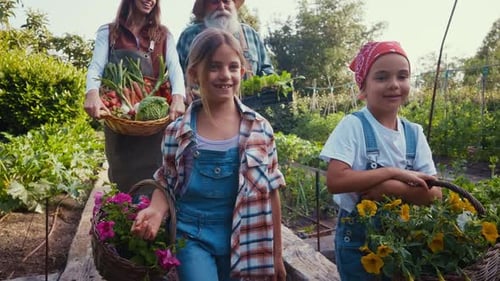 Happy Family Gardening Together on a Sunny Day