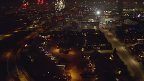 Aerial View Of Stunning Display Of New Year's Eve Fireworks Lighting Up City In Iceland On Winter Ni