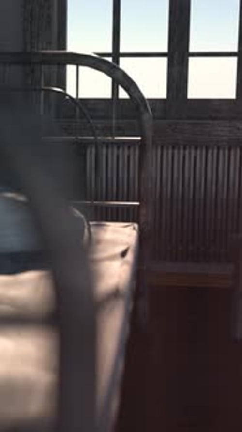 Atmospheric Slow Camera Pan Through an Old Room with Bed