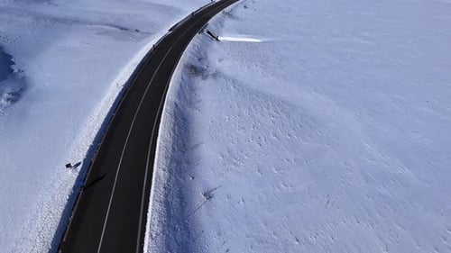 Aerial Drone View of Snowy Mountain Road in Abruzzo Italy