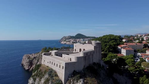 Drone Flying Around Fort Lovrijenac Or St. Lawrence Fortress In Dubrovnik Croatia With Houses In The