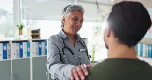 Doctor Comforts Patient During Medical Appointment