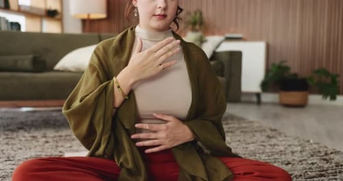 Woman Practices Yoga Meditation in Relaxing Home Setting