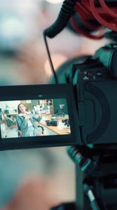 Video camera, screen or woman as influencer with headphones, audio equipment and tips for giveaway