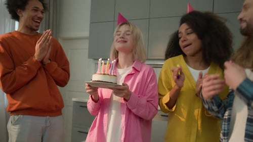 Friends Celebrate Birthday with Cake and Candles