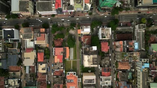 Aerial Top View of Vibrant Asian Cityscape with Dynamic Traffic Busy Streets with Moving Cars