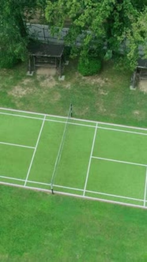 Vertical Screen Tennis Grass Court Aerial Top View Ascending Aerial Shot of