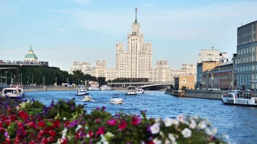 Kotelnicheskaya Embankment Building Overlooking Moskva River with Boats Navigating