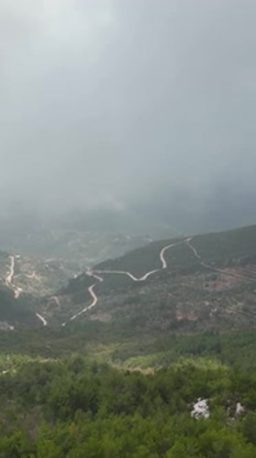Vertical Video Cloudy Landscape in the Mountains Aerial View