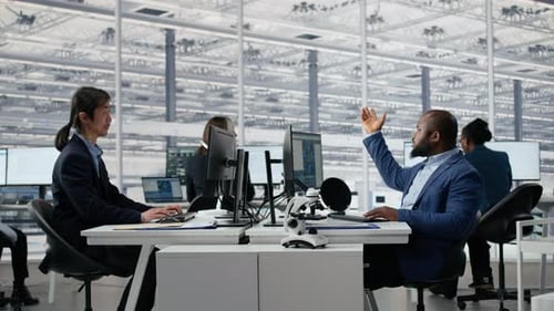 Multiracial Men and Women in Microchip Factory Office Working Together