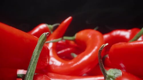 Red pepper is so sharp and burning that smoke comes from it. Dolly slider extreme close-up