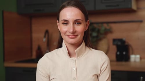 Young Beautiful Modern Woman Stand Near Table on Kitchen at Home