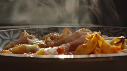 Fresh Tomato Pasta Dish with Steam Rising in Slow Motion