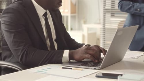 African American Businessman Working on Laptop in Office
