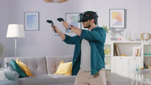 Man with VR Headset Playing Video Game at Home