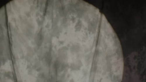 Clown in Makeup with Striped Jacket and Beret