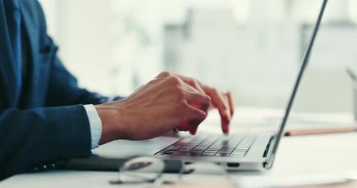 Typing on Laptop in Corporate Office Setting