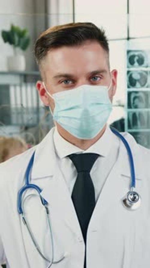 Young Doctor in Lab Coat and Face Mask