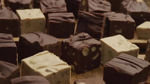 Variety of Handmade Chocolate Fudge on Wooden Tray