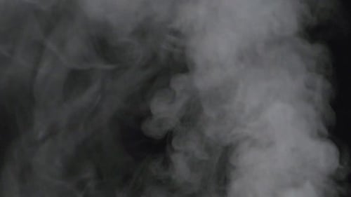 Gray Smoke Swirling on a Black Background