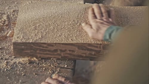 Old Master Hand Blows Away Dust From Oak Boards