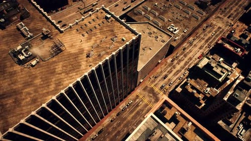 An Aerial View of a Bustling City with Towering Skyscrapers and Busy Roadways