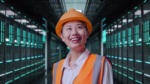 Close Up Side View Of Asian Female Engineer Looking Around in Data Center