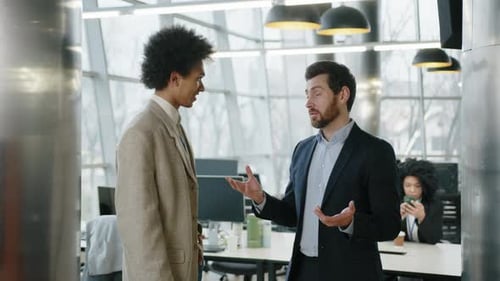 Closeup View of Male Professionals Discussing New Financial Report in Office