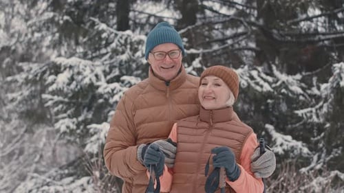 Portrait of Active Senior Couple in Winter Forest
