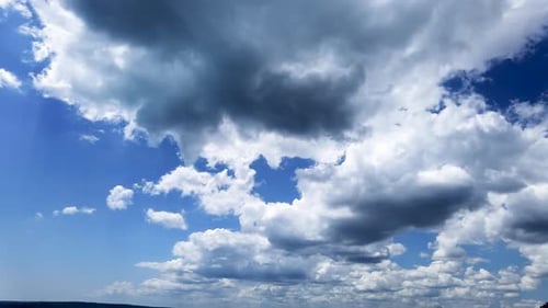 Fluffy White Clouds Time Lapse on Blue Sky