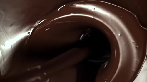 Chocolat liquide fondu filmé par une caméra haute vitesse à 1000 images par seconde