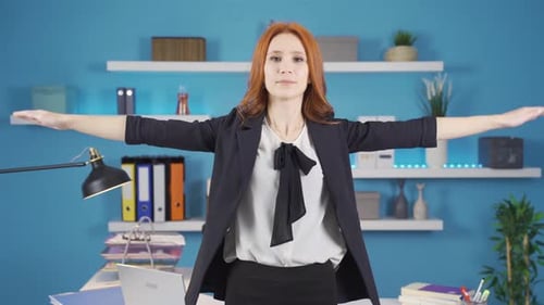 Exercises that can be done in the office. Business woman doing standing exercises.