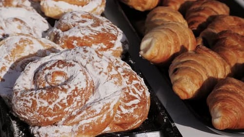 Close Up Taking Out Tasty Golden Croissants in French Spanish Bakery Traditional France Cuisine
