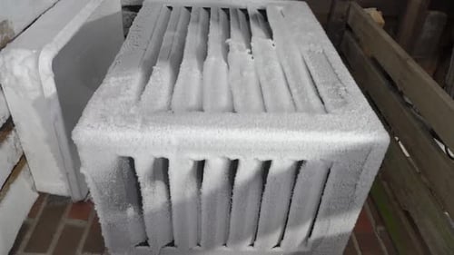 Air Source Heat Pump Outdoor Unit Covered with Snow and Frost