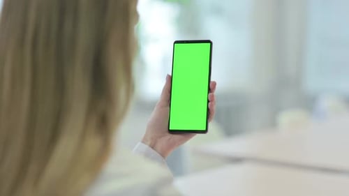 Woman using Smartphone with Green Screen Chroma Key