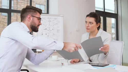 Female hr manager interviewing male job candidate in modern office
