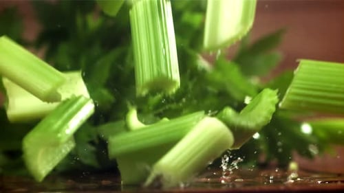 Pieces of Chopped Celery Fall on the Table Filmed on a Highspeed Camera at 1000 Fps