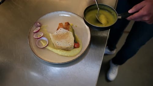 Sauce Being Added to Plated Food