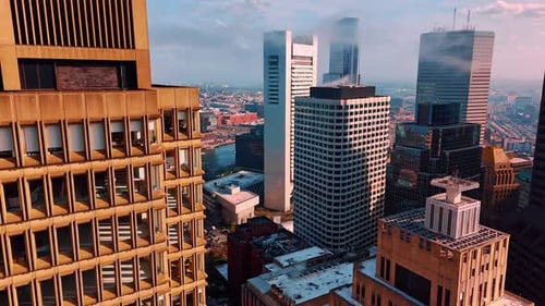 Smog rises from the tops of high-rise buildings. Air pollution in modern Boston, Massachusetts, USA