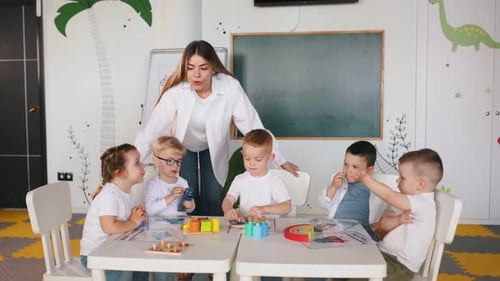 Teacher and Young Children Learning with Toys