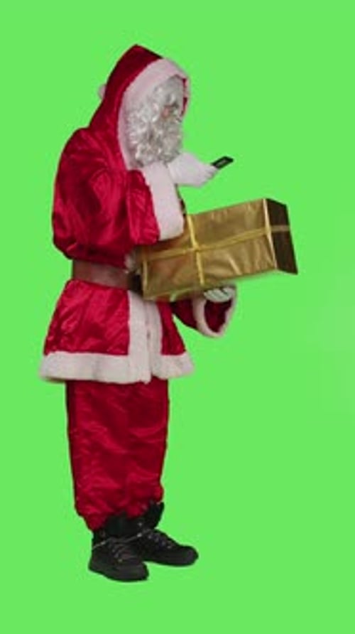 Vertical Video Side View of Santa Claus Taking Picture of Gift Box