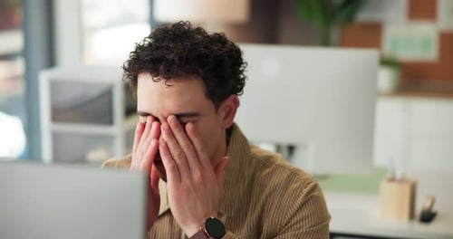 Tired, computer or man with glasses in office from burnout, eye strain or overworked on article