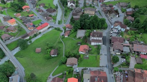 Flying over Lauterbrunn in Grindelwald Switzerland revealing the landscape and village, landscape a