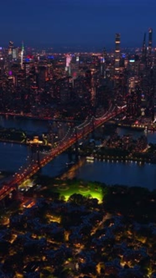 Billions of bright lights of New York at night. Amazing bridge over the river